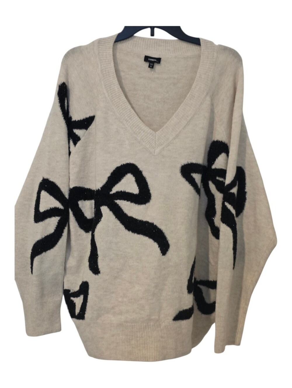Express Cream V-Neck Sweater with Black Bow Motif